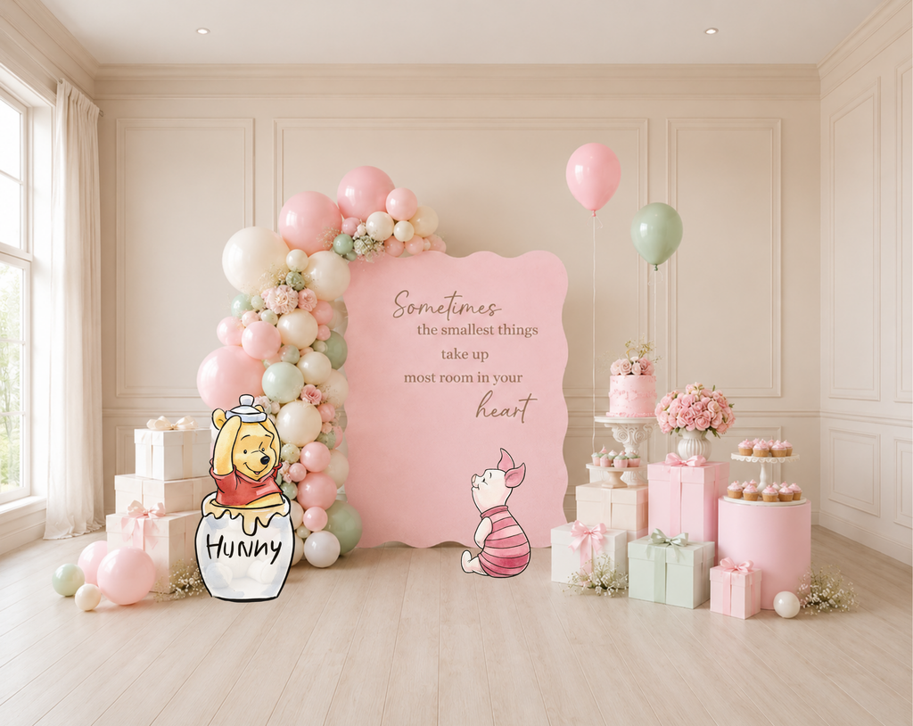 Pink classic bear baby shower backdrop with pastel balloon garland, whimsical character details and personalized party styling.