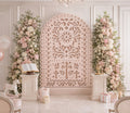 Blush pink religious papel picado backdrop with cross design and floral Christian event decor