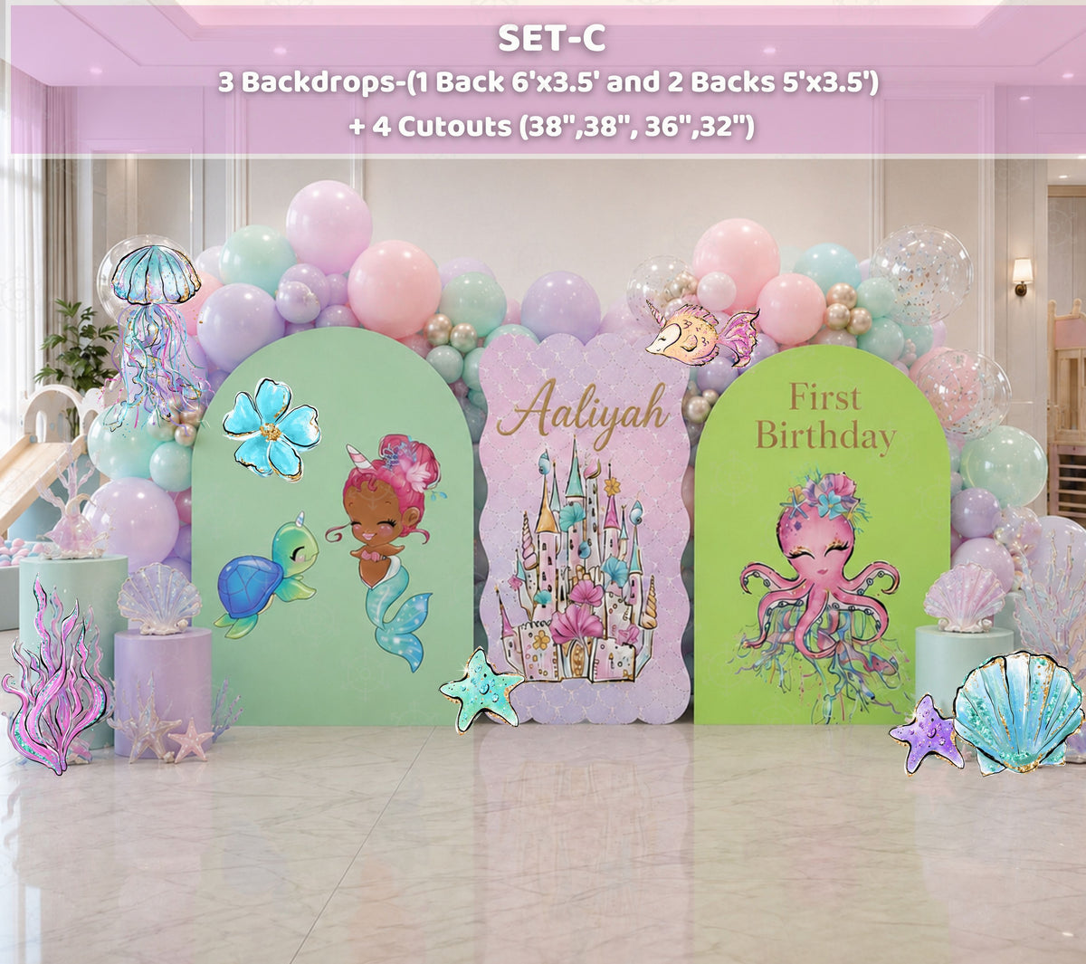 Pastel little mermaid party backdrop with aqua arch panels, balloons and ocean character cutouts