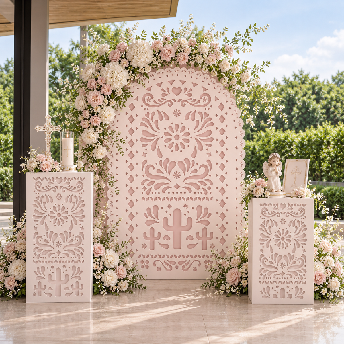 Blush pink Papel Picado backdrop with matching pink pedestals and balloon decor