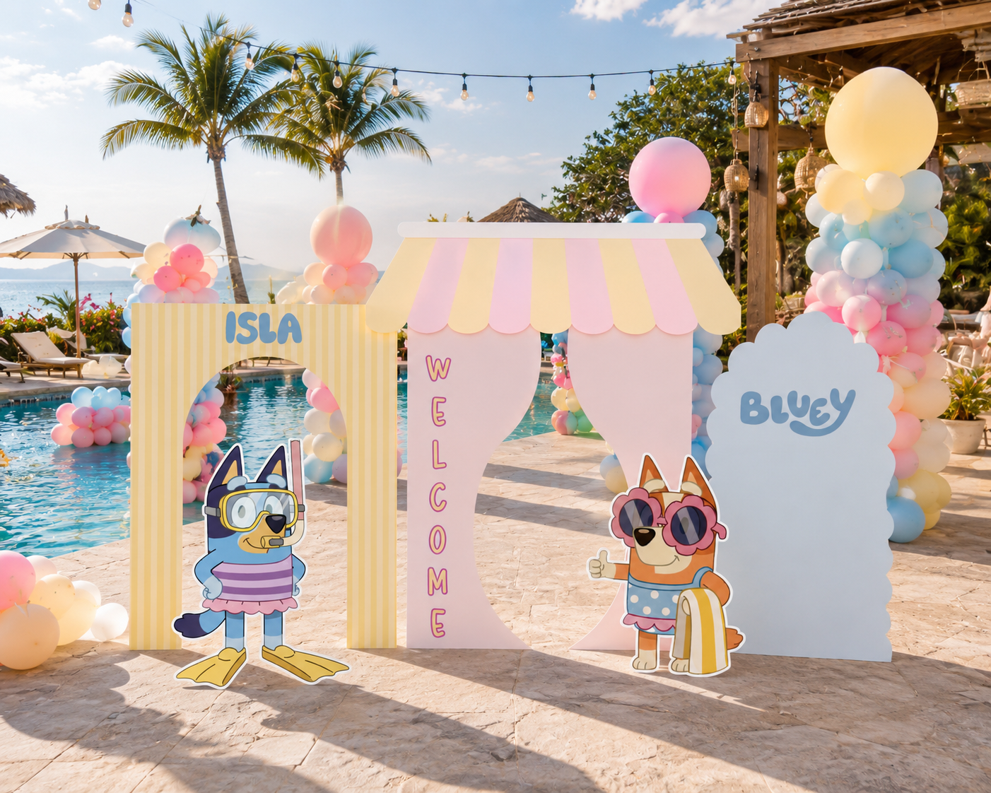Pastel summer birthday backdrop with layered arch panels, blue puppy cutouts and poolside party styling for a kids celebration.