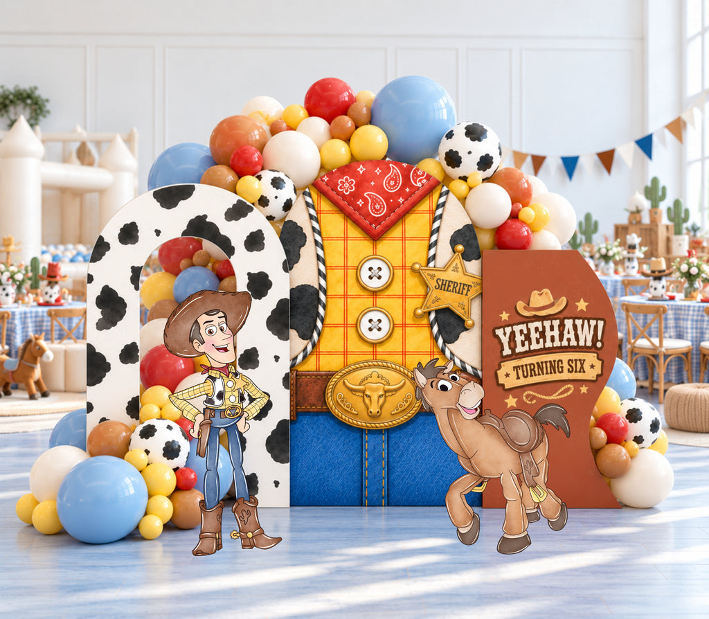 Western toy birthday display with sheriff star centerpiece, colorful balloon garland and matching cowboy-inspired cutouts.