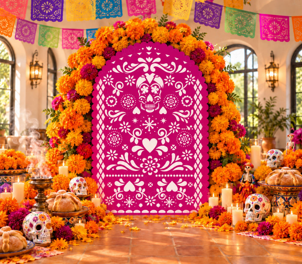 Bright pink papel picado-inspired backdrop with orange marigolds, colorful banner accents and vibrant Mexican fiesta party styling.