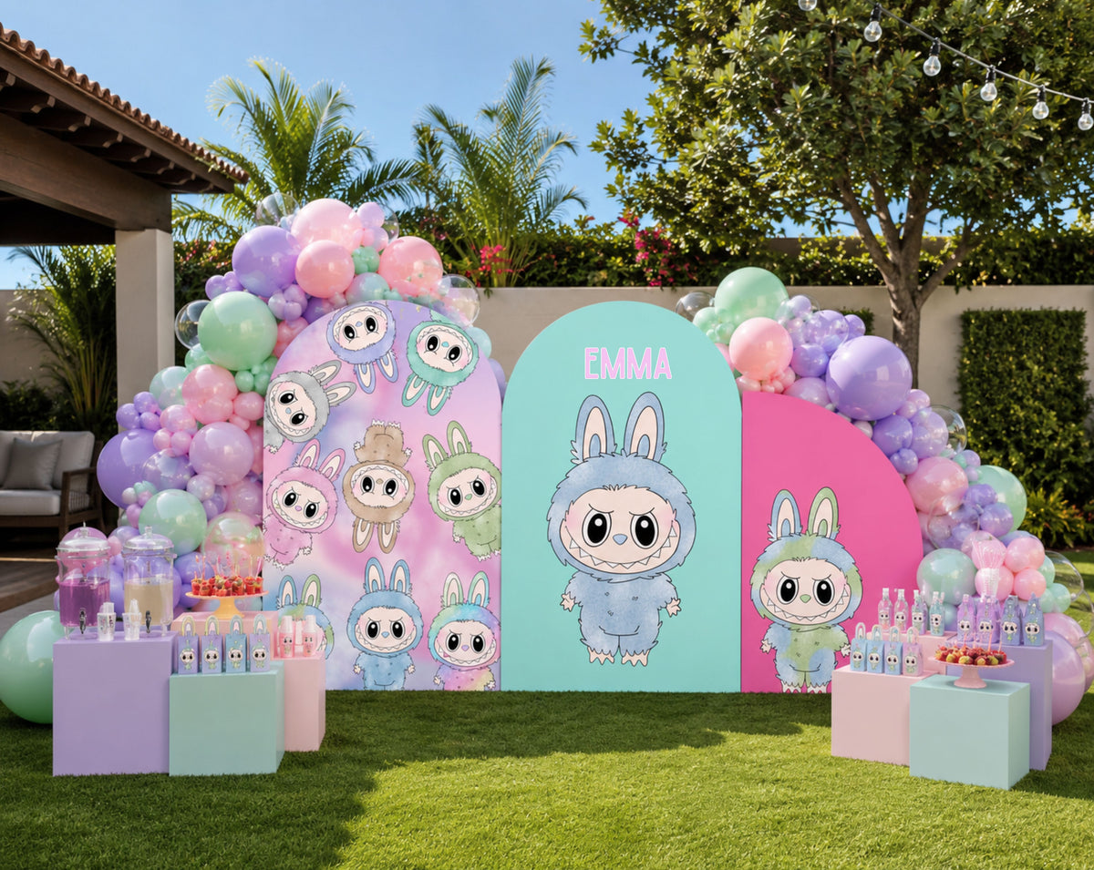Outdoor kawaii monster birthday backdrop with pastel balloons, layered panels and cute monster cutouts for a personalized celebration.