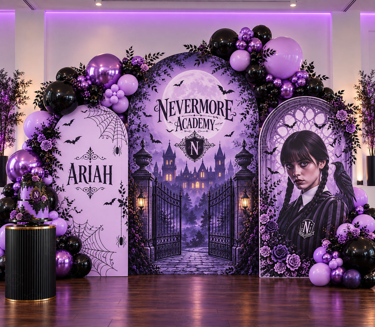 Personalized gothic party backdrop with purple balloon garland, spiderweb artwork and dark character-inspired birthday decorations.