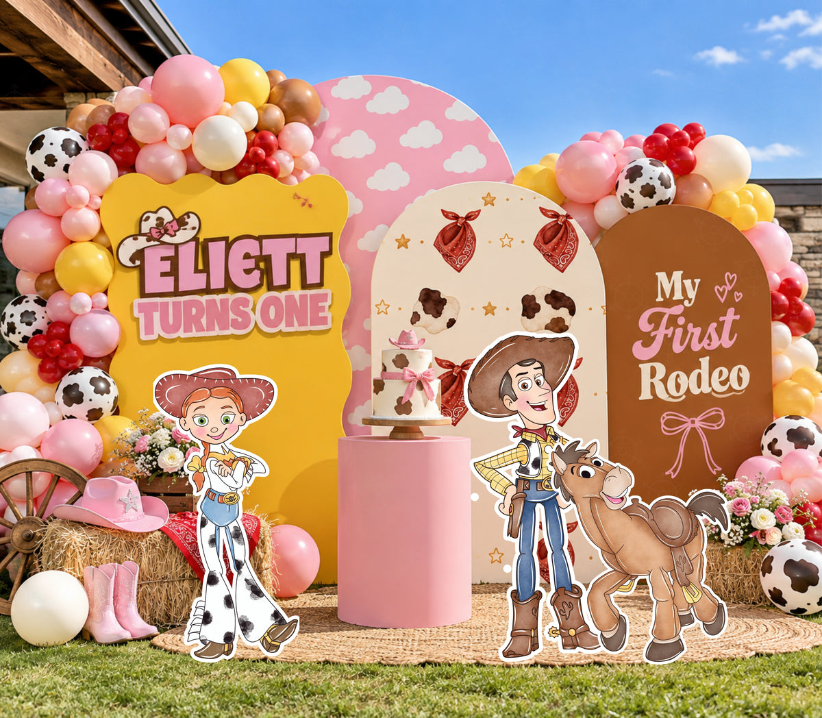 Outdoor western toy birthday backdrop with pink orange and yellow arch panels, colorful balloons and character cutouts for a kids party.
