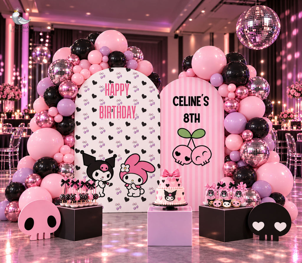 Personalized pink birthday backdrop with black accents, playful character cutouts and coordinated balloon decor for a kids party.