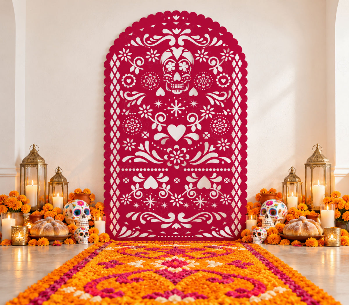 Pink papel picado-inspired backdrop with floral cutout details, marigold arrangements and colorful Mexican-inspired party decor.