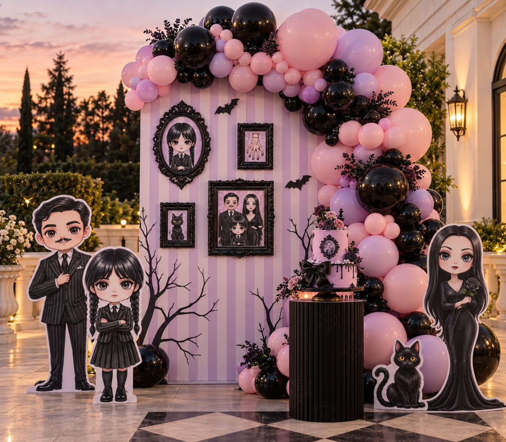 Pink and black gothic birthday backdrop with framed wall details, balloons and personalized character decor for a photo-ready party.