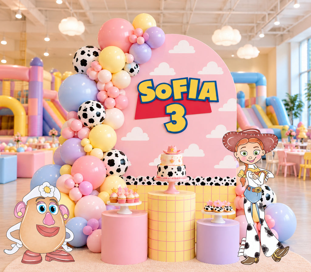 Pink western birthday backdrop with cowgirl inspired character cutouts, pastel balloons and playful custom party styling.