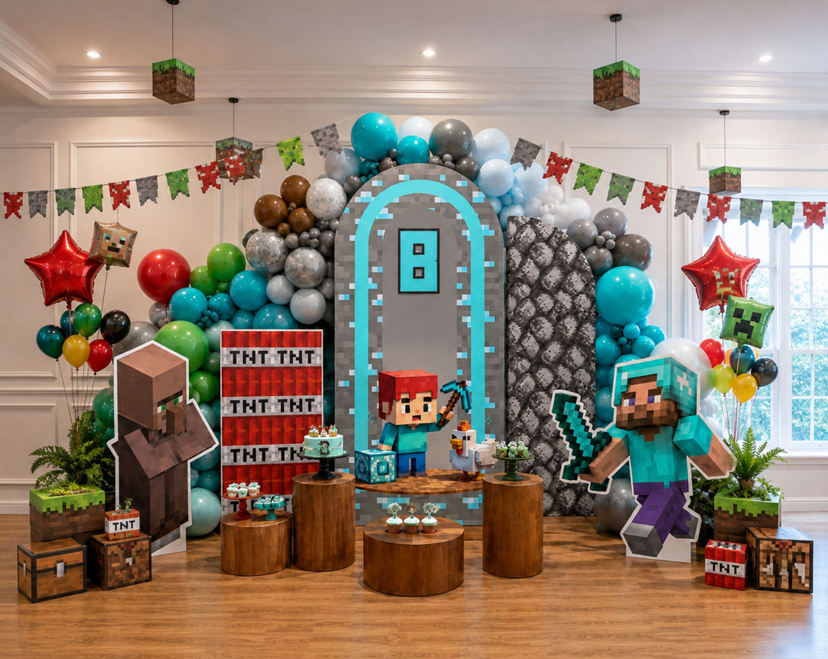 Pixel game birthday party backdrop with blue arched panel, colorful balloon garland, rustic wood pedestals and block game inspired decorations.