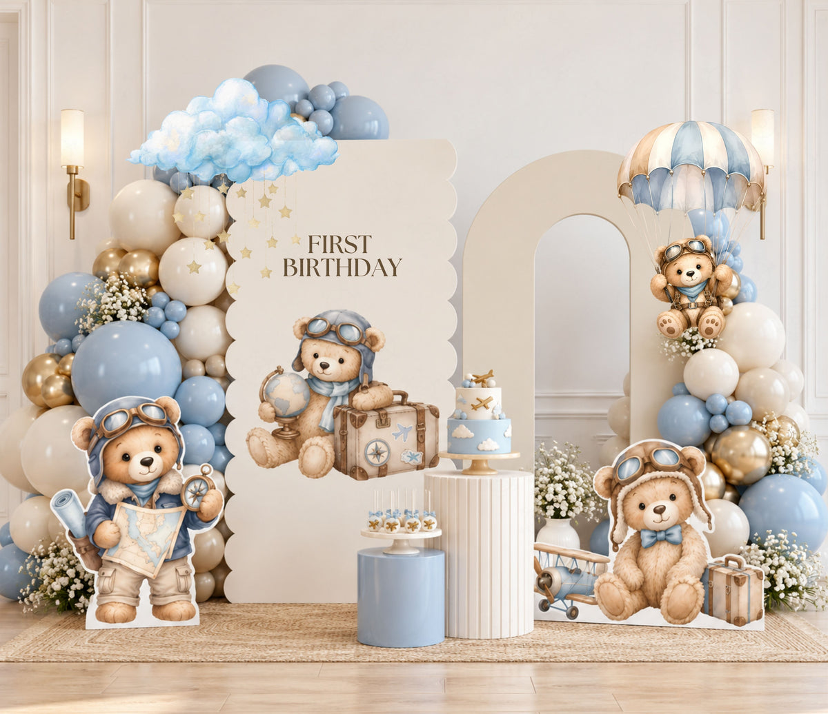 Soft blue aviator bear birthday backdrop with neutral balloons, hot air balloon details and coordinated baby boy party decorations.