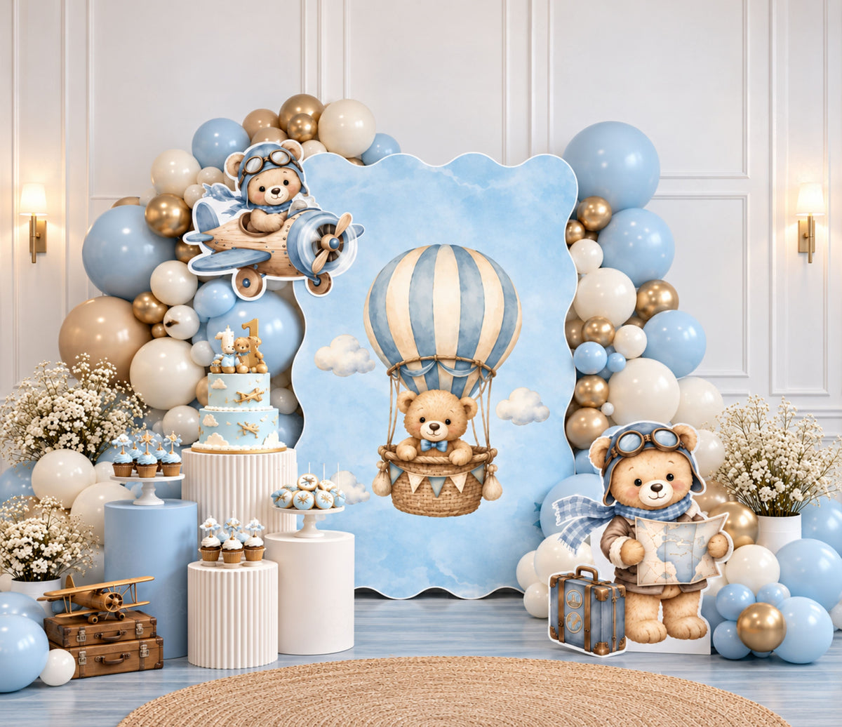 Aviator bear first birthday backdrop with soft blue panels, hot air balloon accents, neutral balloons and coordinated character decorations.