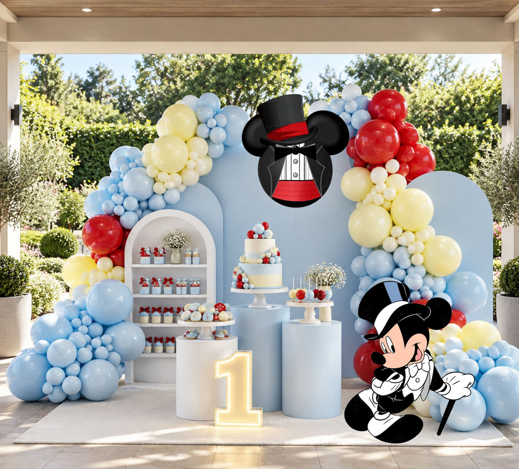 Classic mouse party backdrop with light blue arch panels, balloon garland and matching character decor in an outdoor setup.