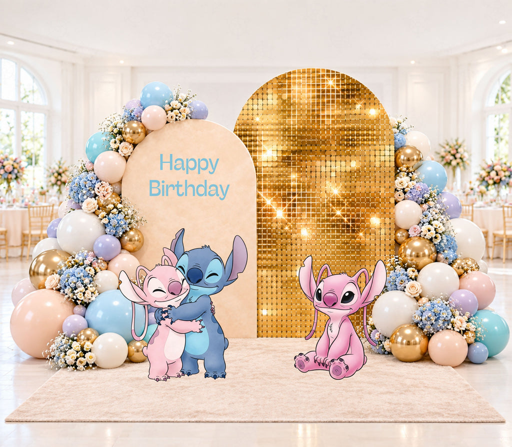 Pastel alien birthday backdrop set with a metallic gold center panel, soft blue and cream accents, balloons and matching themed decorations.