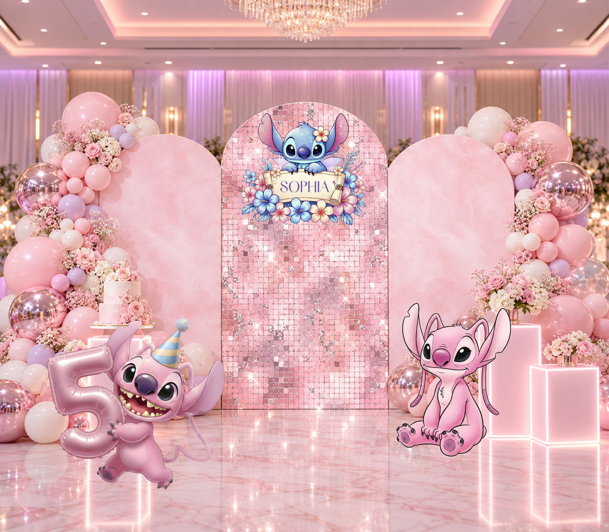 Pink alien birthday backdrop with blush arched panels, floral-inspired details, pastel balloons and coordinated character party decorations.