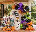 Spooky character birthday backdrop with orange purple black and green balloons, pumpkin accents, character cutouts and personalized party decor.
